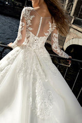 Illusion Neck A-Line Wedding Dress with Long Sleeves and Sweep Train crafted from Lace and Tulle