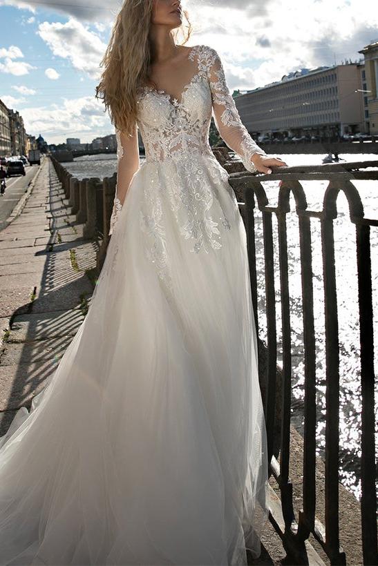 Illusion Neck A-Line Wedding Dress with Long Sleeves and Sweep Train crafted from Lace and Tulle