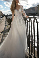 Illusion Neck A-Line Wedding Dress with Long Sleeves and Sweep Train crafted from Lace and Tulle