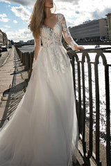 Illusion Neck A-Line Wedding Dress with Long Sleeves and Sweep Train crafted from Lace and Tulle