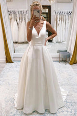 Chic Ivory A-Line Deep V-Neck Long Beach Wedding Dress with Bowknot